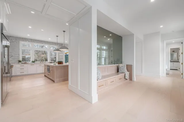 a view of a living room and kitchen with hardwood floor