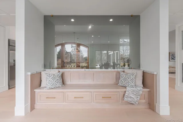 a view of kitchen with granite countertop couches and chandelier