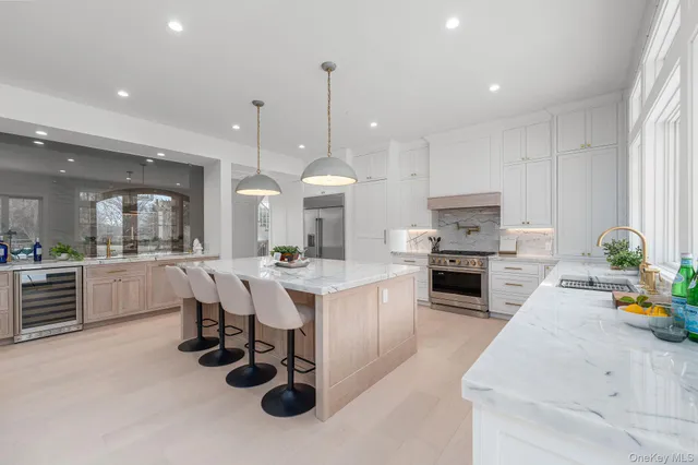 a large kitchen with a table and chairs in it