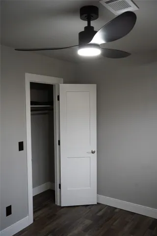 an empty room with wooden floor