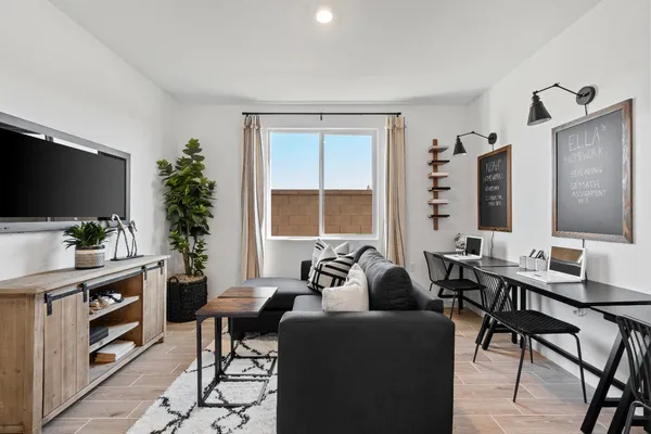 a living room with furniture and a large window