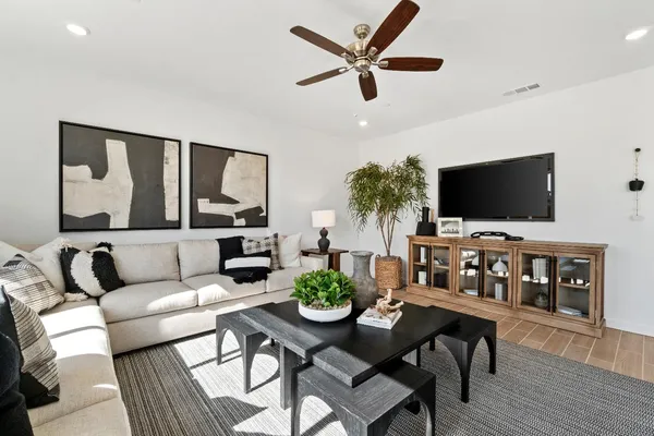 a living room with furniture and a large window
