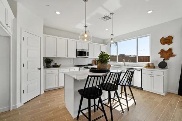 a kitchen with counter space cabinets and appliances
