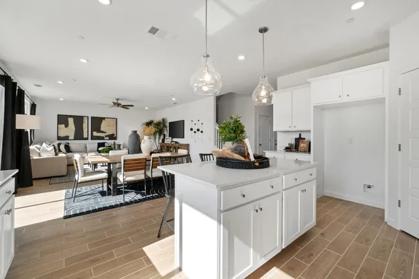 a very nice looking living room with kitchen island furniture and a wooden floor