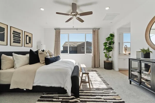 a bathroom with a double vanity sink a mirror a bathtub and shower