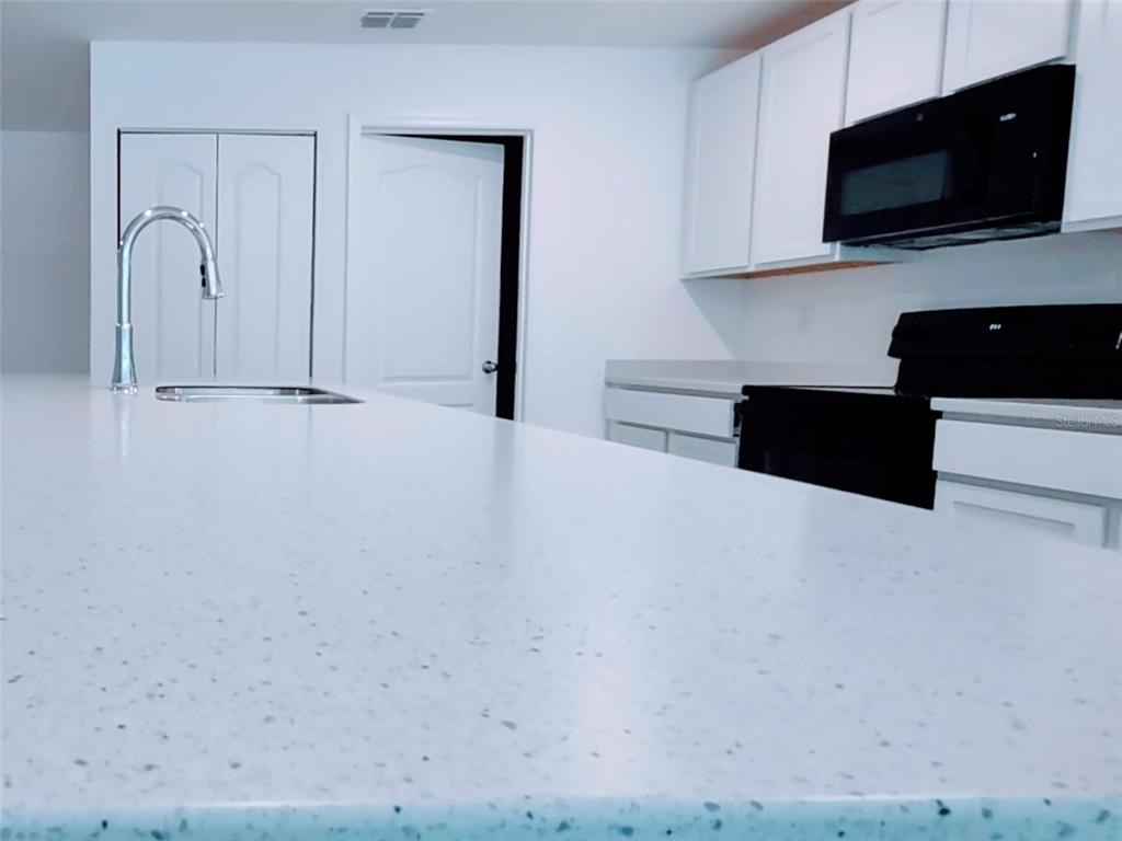 108 West Goldcoast Place Dunnellon, FL 34434 - Photo 11 of 26 a view of living room with stainless steel appliances wooden cabinets