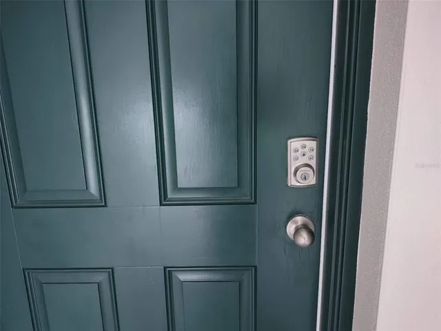 a backyard of a house with potted plants