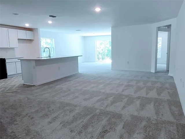 a kitchen with a sink and tap