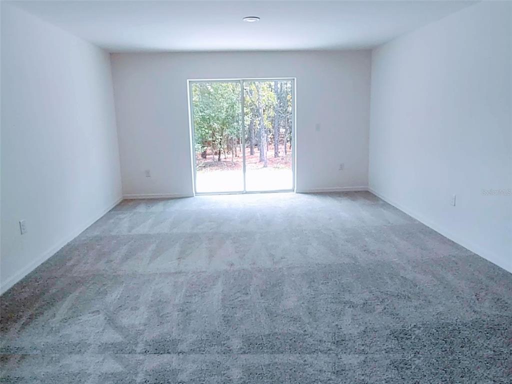 108 West Goldcoast Place Dunnellon, FL 34434 - Photo 20 of 26 an empty room with windows