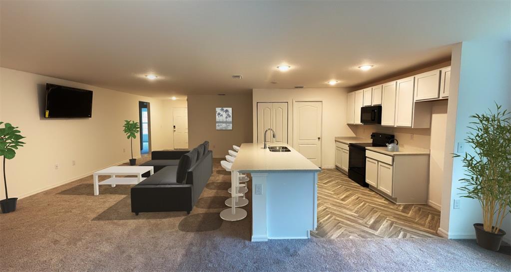 108 West Goldcoast Place Dunnellon, FL 34434 - Photo 25 of 26 a kitchen with sink refrigerator and microwave