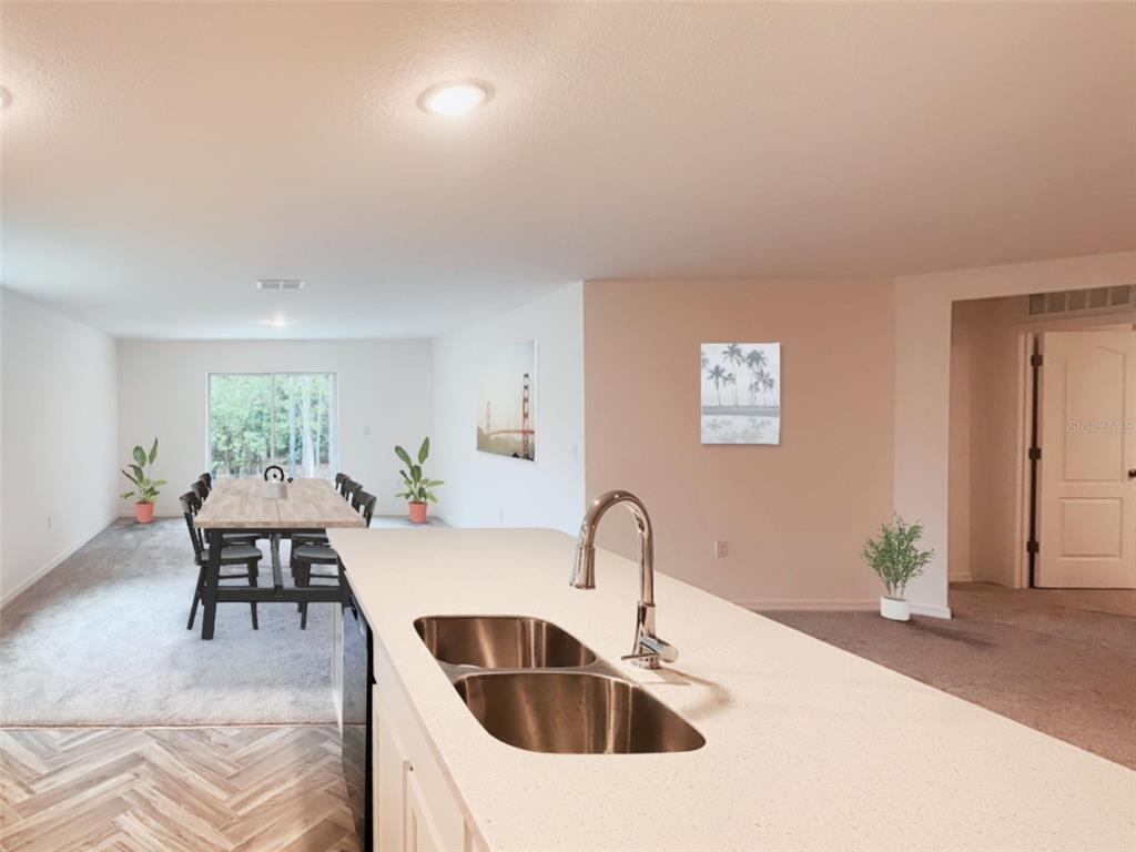 108 West Goldcoast Place Dunnellon, FL 34434 - Photo 7 of 26 a kitchen with a table and chairs