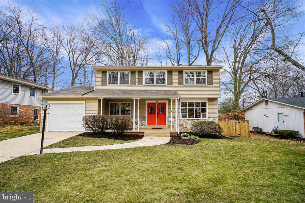 10113 Cardinal Road Fairfax, VA 22030 - Photo 1 of 59 a front view of a house with a yard and garage