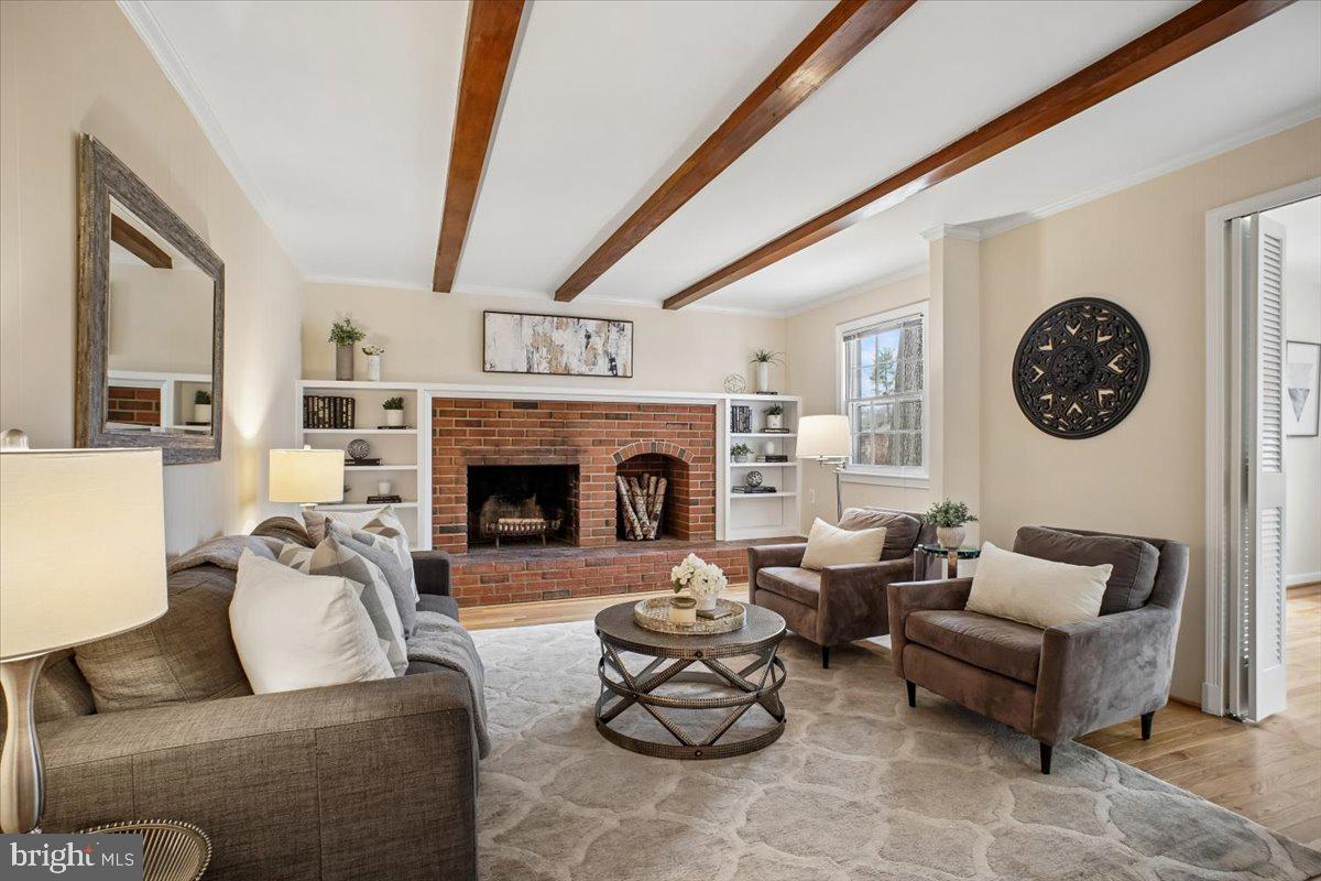 10113 Cardinal Road Fairfax, VA 22030 - Photo 17 of 59 a living room with furniture a fireplace and a large window