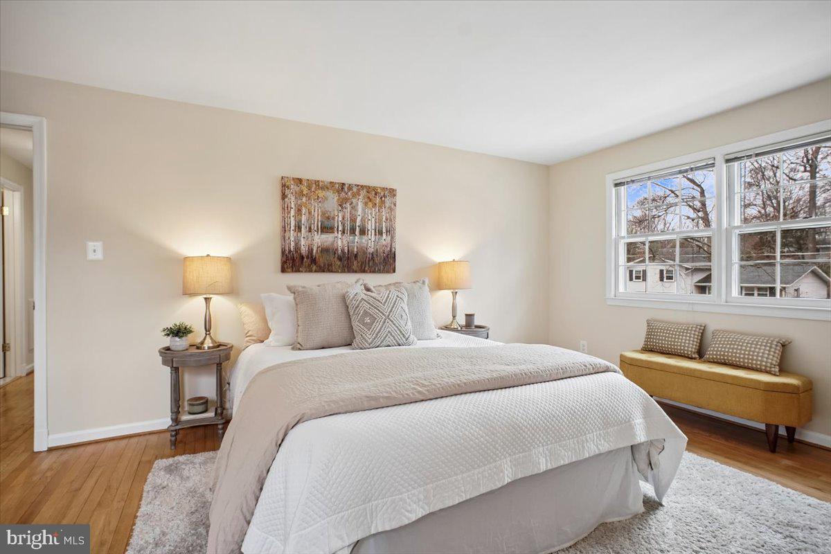 10113 Cardinal Road Fairfax, VA 22030 - Photo 27 of 59 a bedroom with a bed and a couch