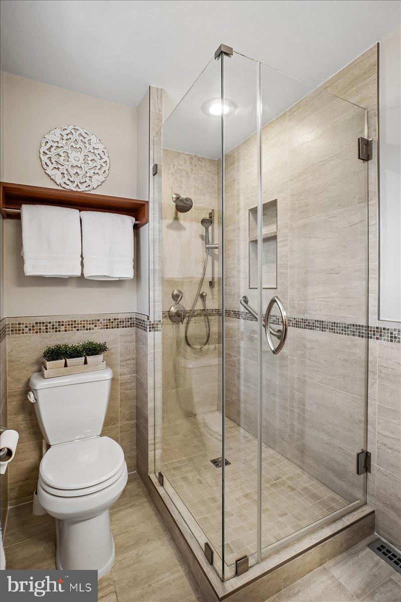 10113 Cardinal Road Fairfax, VA 22030 - Photo 31 of 59 a bathroom with a toilet and a shower