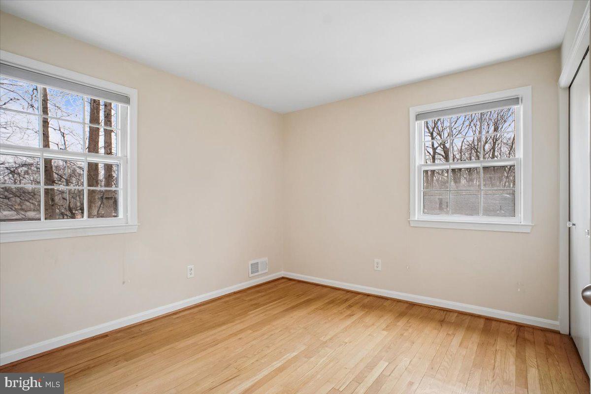 10113 Cardinal Road Fairfax, VA 22030 - Photo 32 of 59 a view of empty room with wooden floor and fan