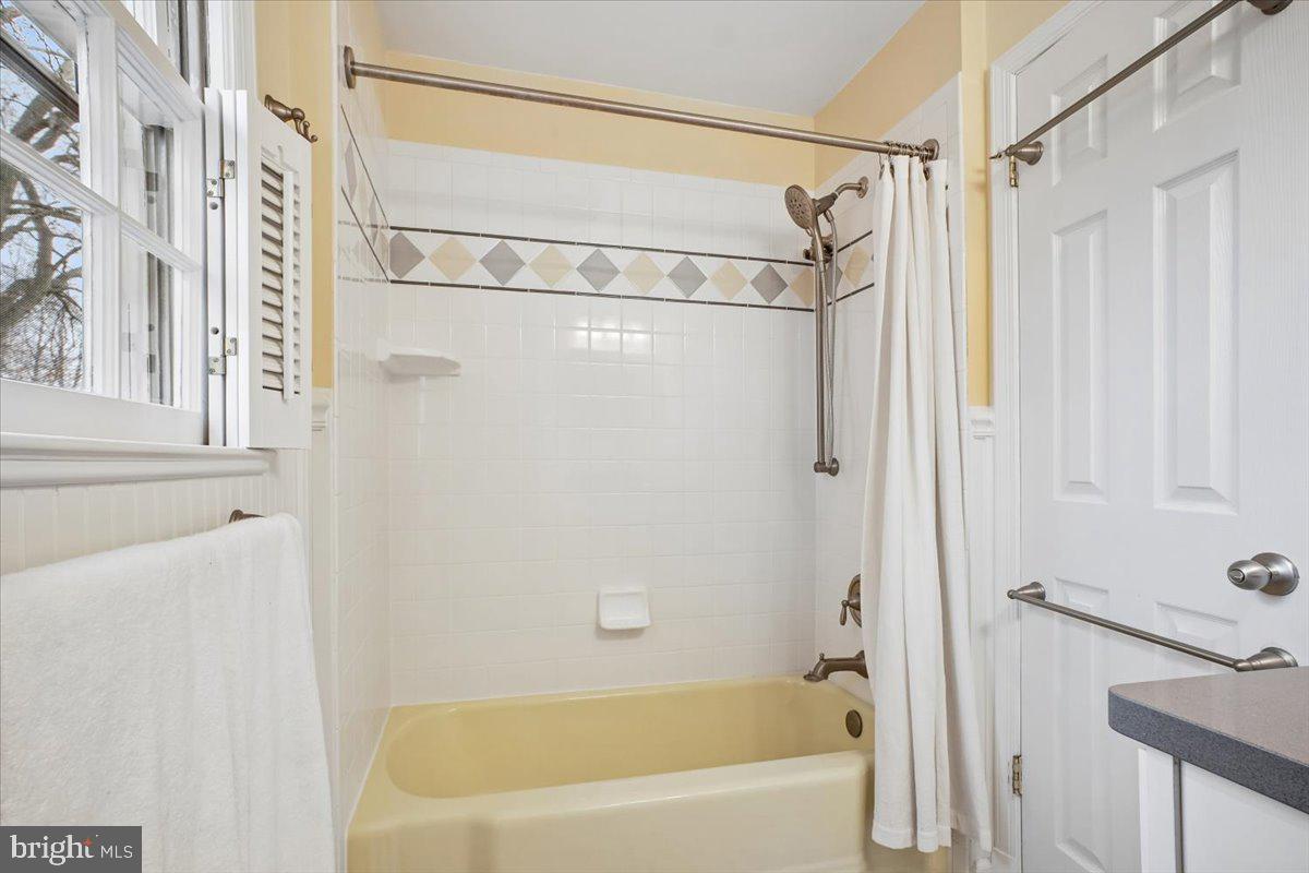 10113 Cardinal Road Fairfax, VA 22030 - Photo 36 of 59 a bathroom with a shower a bath tub and shower