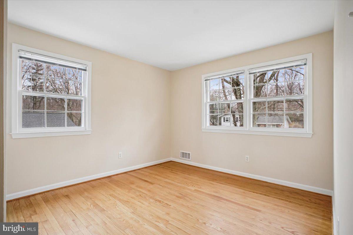 10113 Cardinal Road Fairfax, VA 22030 - Photo 37 of 59 a view of empty room with wooden floor and fan