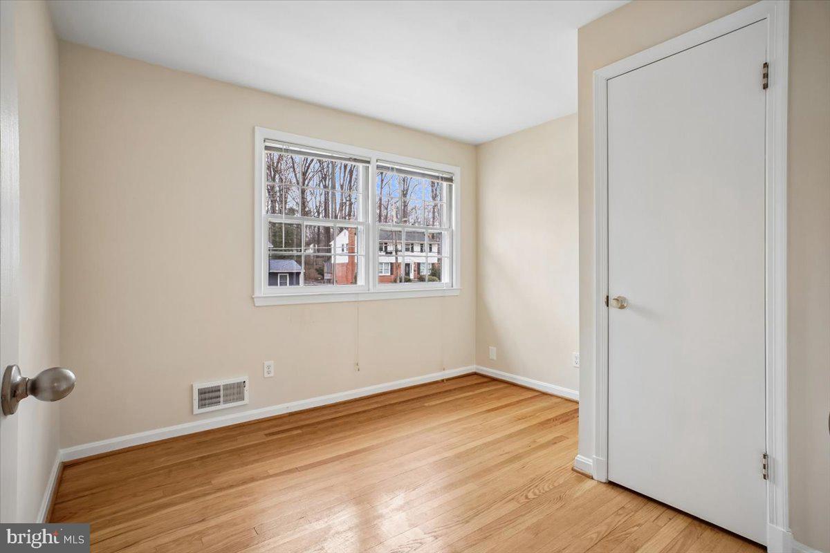 10113 Cardinal Road Fairfax, VA 22030 - Photo 39 of 59 a view of empty room with wooden floor