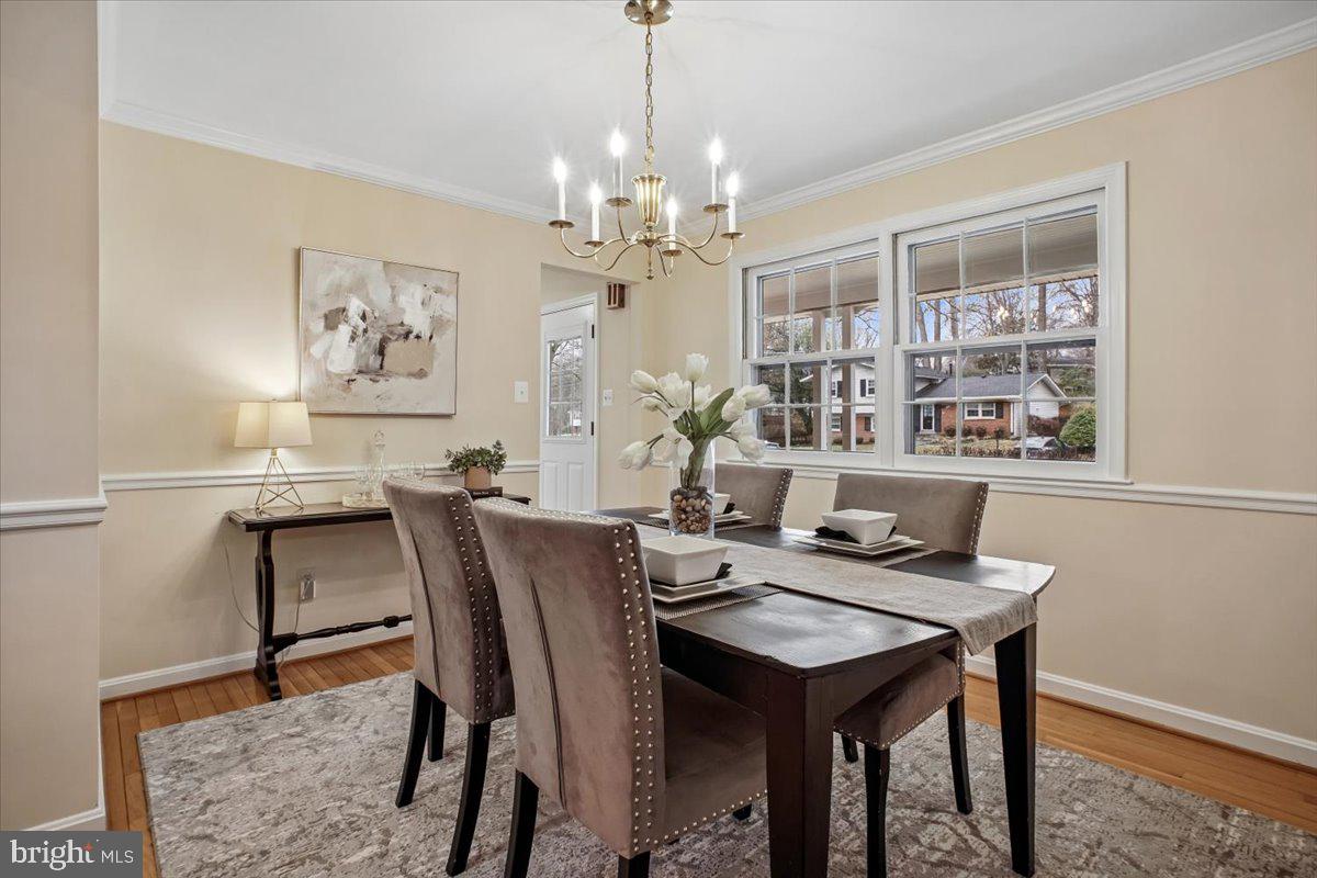 10113 Cardinal Road Fairfax, VA 22030 - Photo 8 of 59 a view of a dining room with furniture window and wooden floor