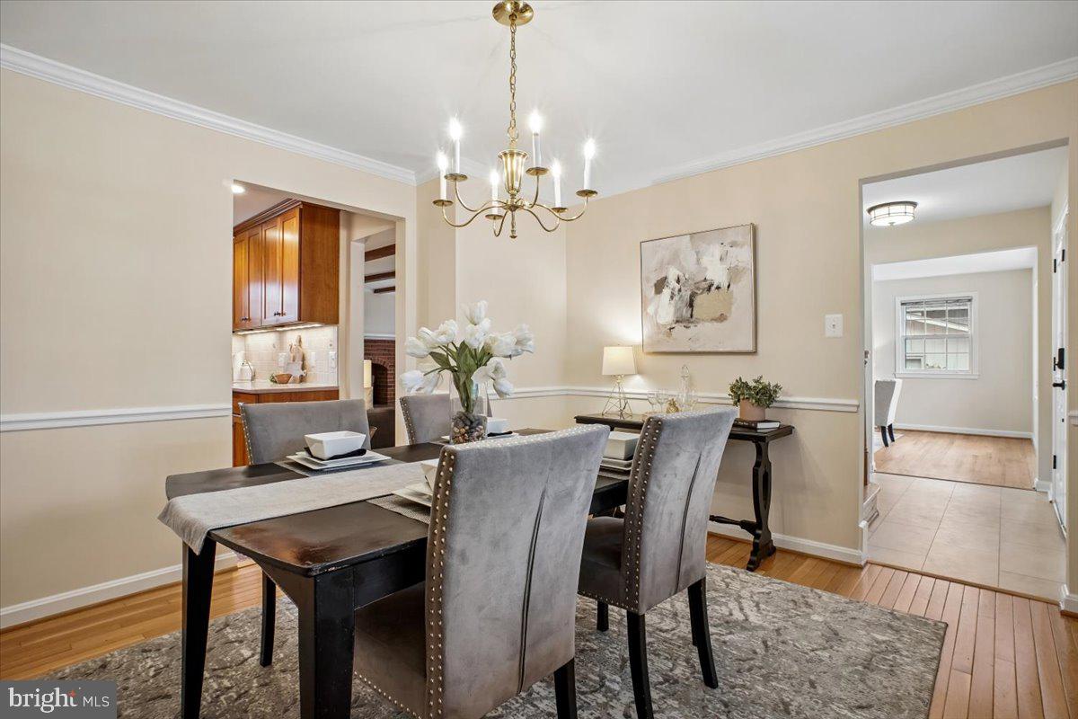 10113 Cardinal Road Fairfax, VA 22030 - Photo 10 of 59 a view of a dining room with furniture and chandelier