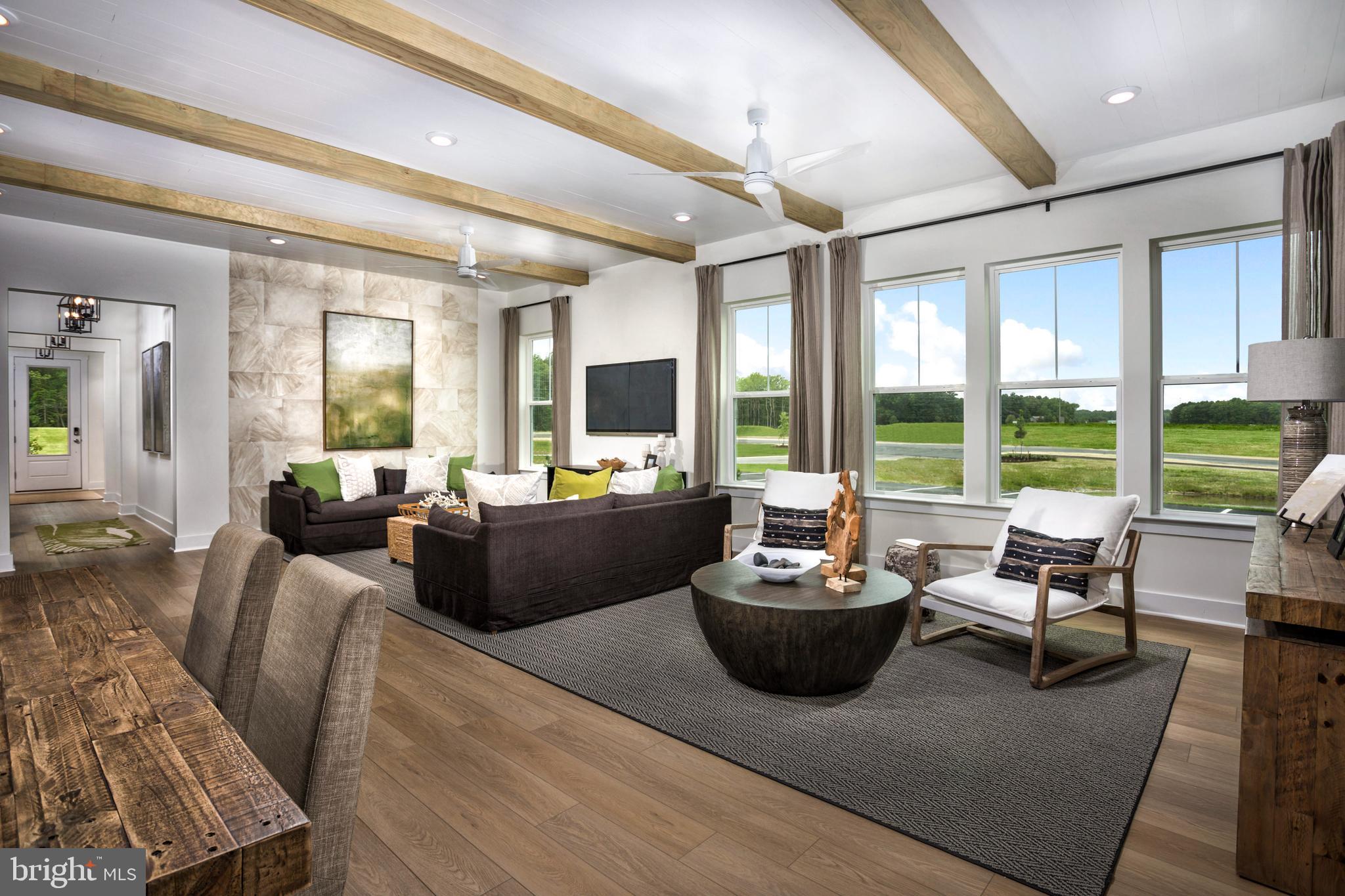 Tbb Salt Cedar Court, Unit PALM Lewes, DE 19958 - Photo 4 of 24 a living room with furniture and a large window