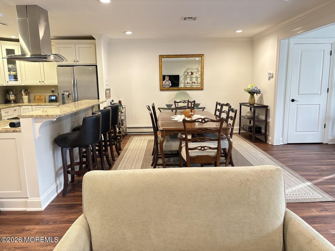 29 Dickinson Court Red Bank, NJ 07701 - Photo 13 of 36 a living room with lots of chairs and kitchen view