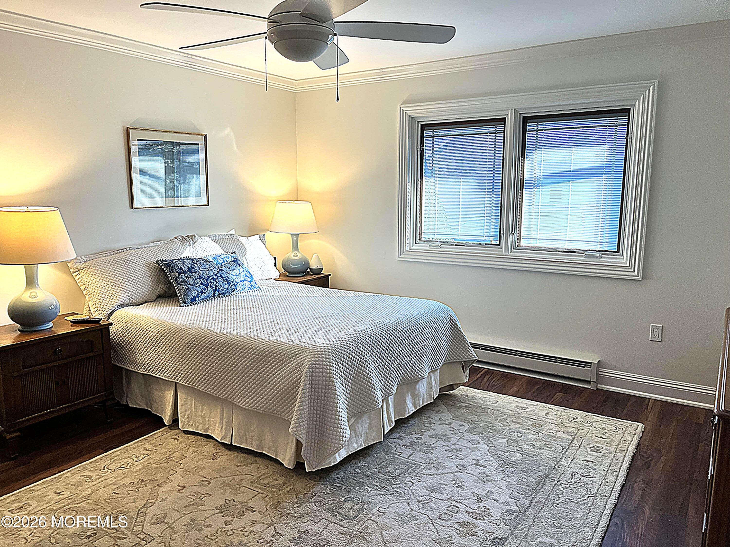 29 Dickinson Court Red Bank, NJ 07701 - Photo 18 of 36 a bedroom with a bed and lamp with window