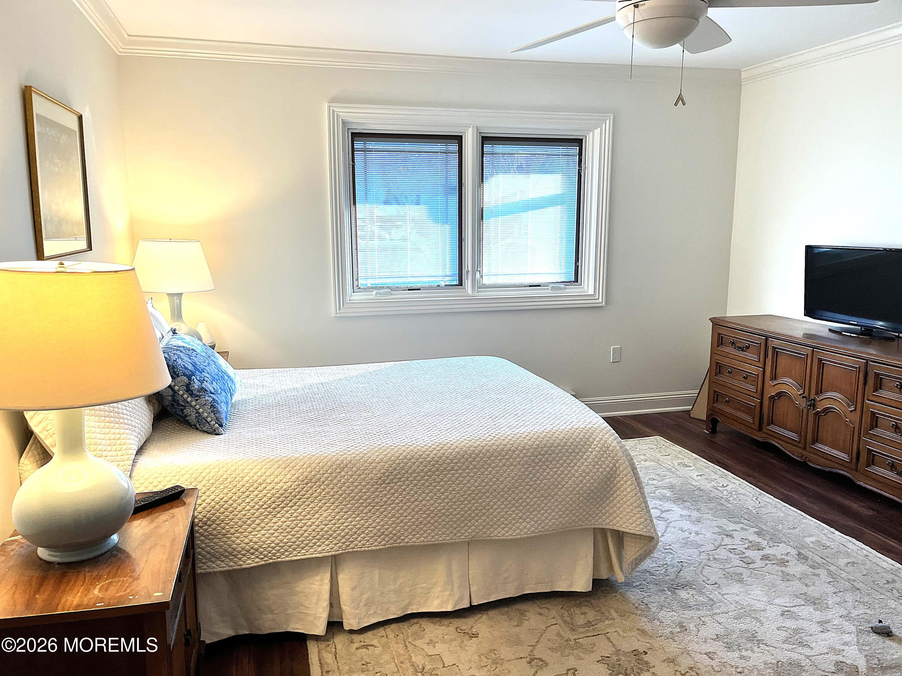 29 Dickinson Court Red Bank, NJ 07701 - Photo 19 of 36 a bedroom with a bed and a tv
