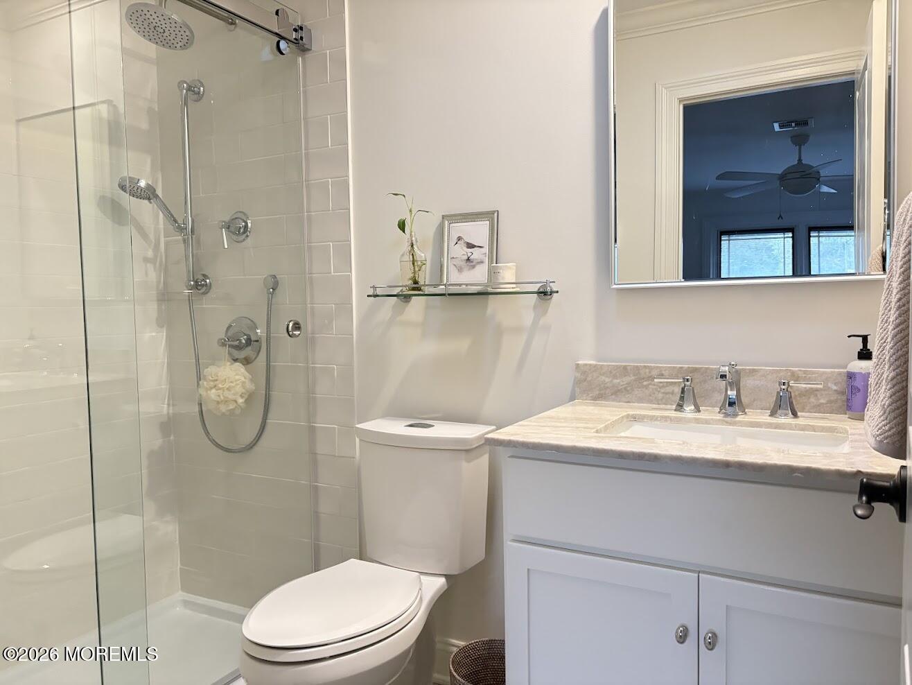 29 Dickinson Court Red Bank, NJ 07701 - Photo 20 of 36 a bathroom with a granite countertop toilet sink and mirror
