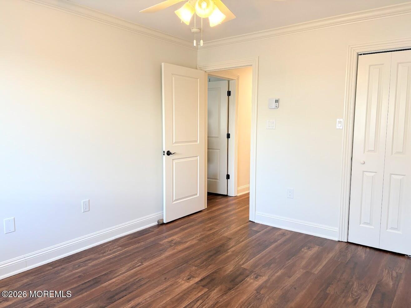 29 Dickinson Court Red Bank, NJ 07701 - Photo 22 of 36 an empty room with wooden floor and windows