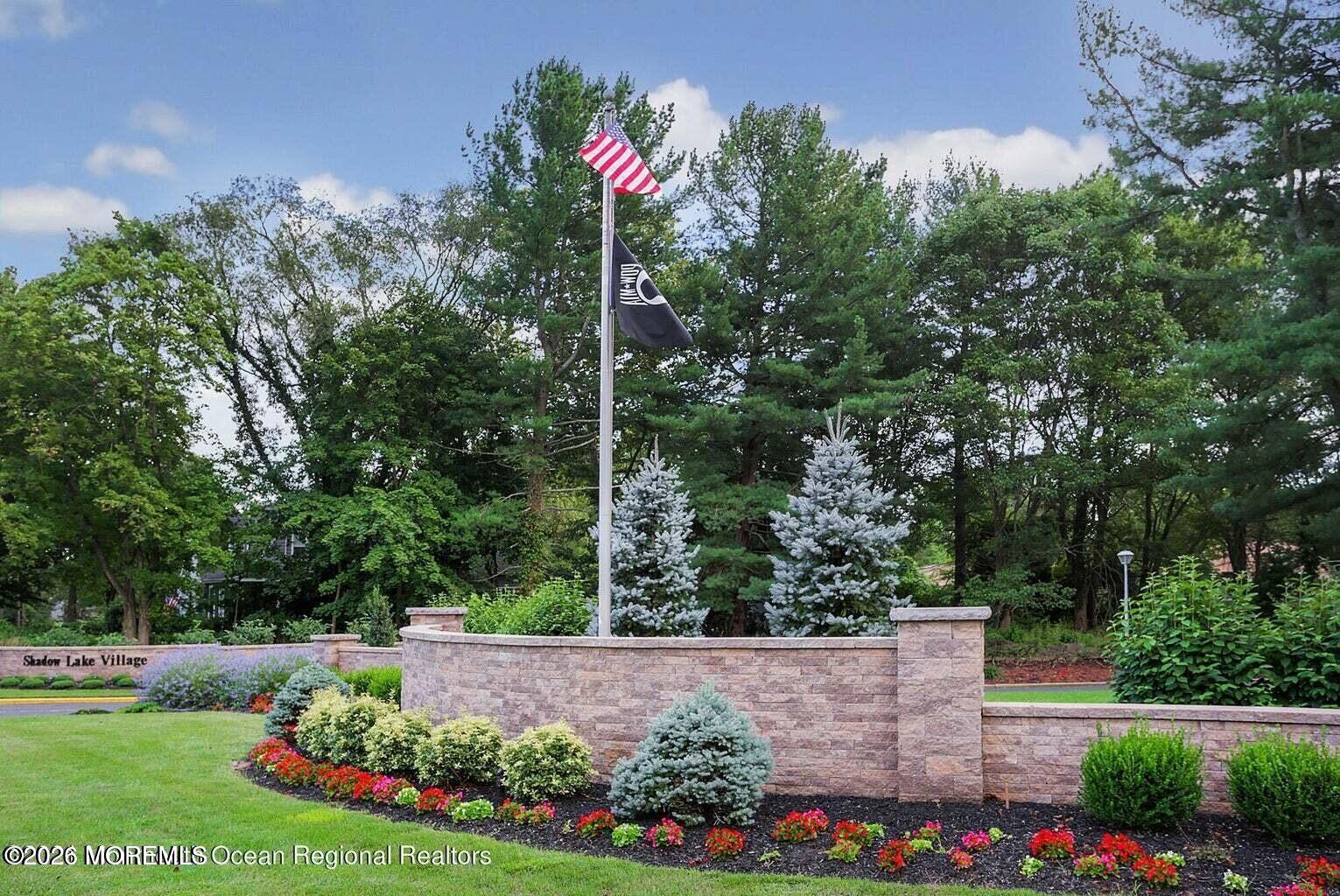 29 Dickinson Court Red Bank, NJ 07701 - Photo 28 of 36 a view of flower garden with wooden fence