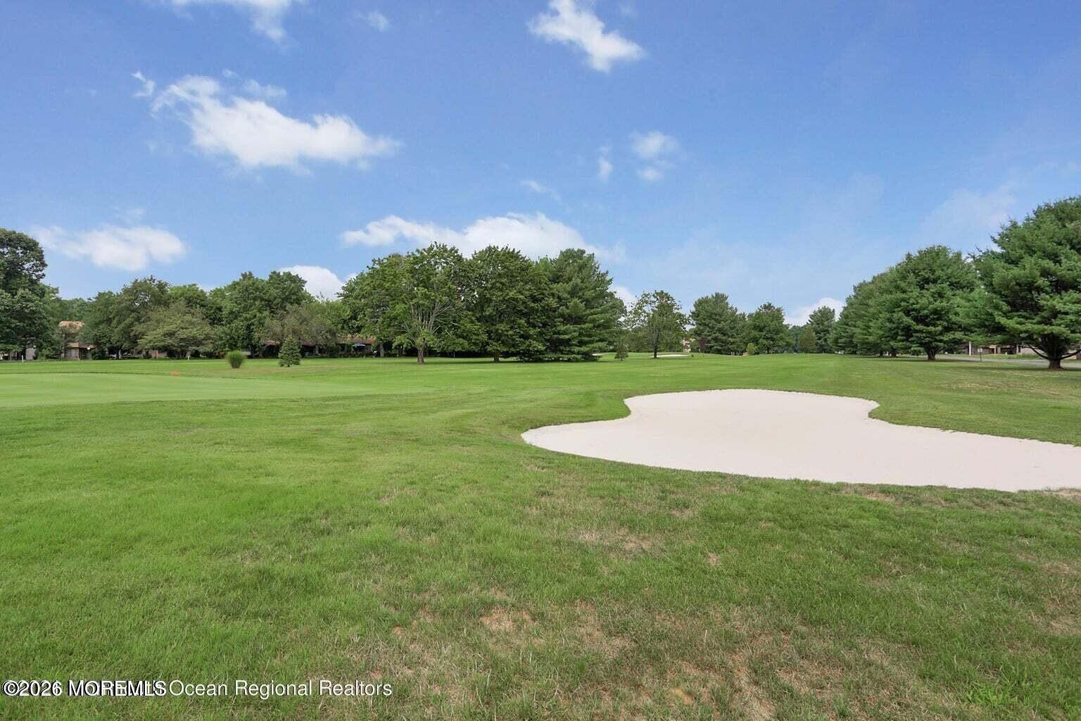 29 Dickinson Court Red Bank, NJ 07701 - Photo 33 of 36 a view of a golf course with a lake