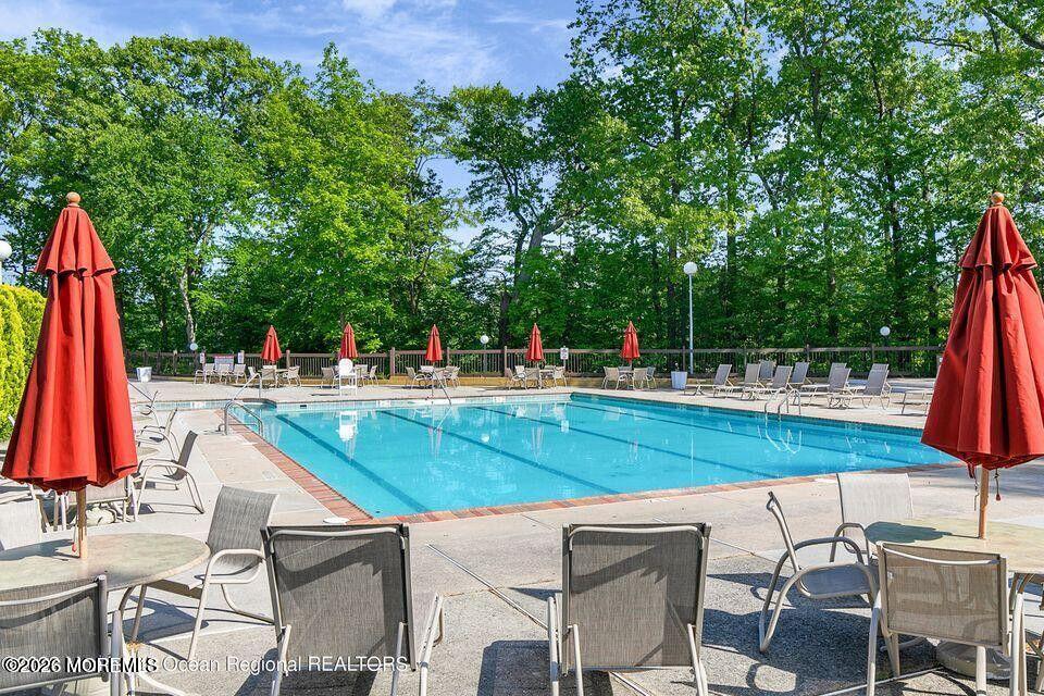 29 Dickinson Court Red Bank, NJ 07701 - Photo 34 of 36 a view of swimming pool with lounge chair and fire pit