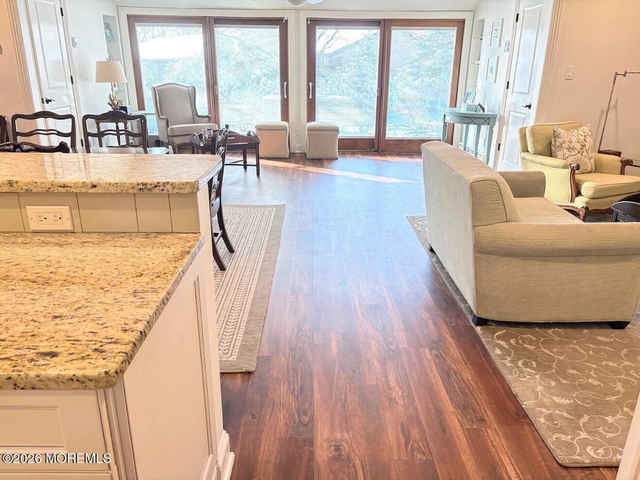 29 Dickinson Court Red Bank, NJ 07701 - Photo 7 of 36 a living room with kitchen island granite countertop wooden floor and a large window