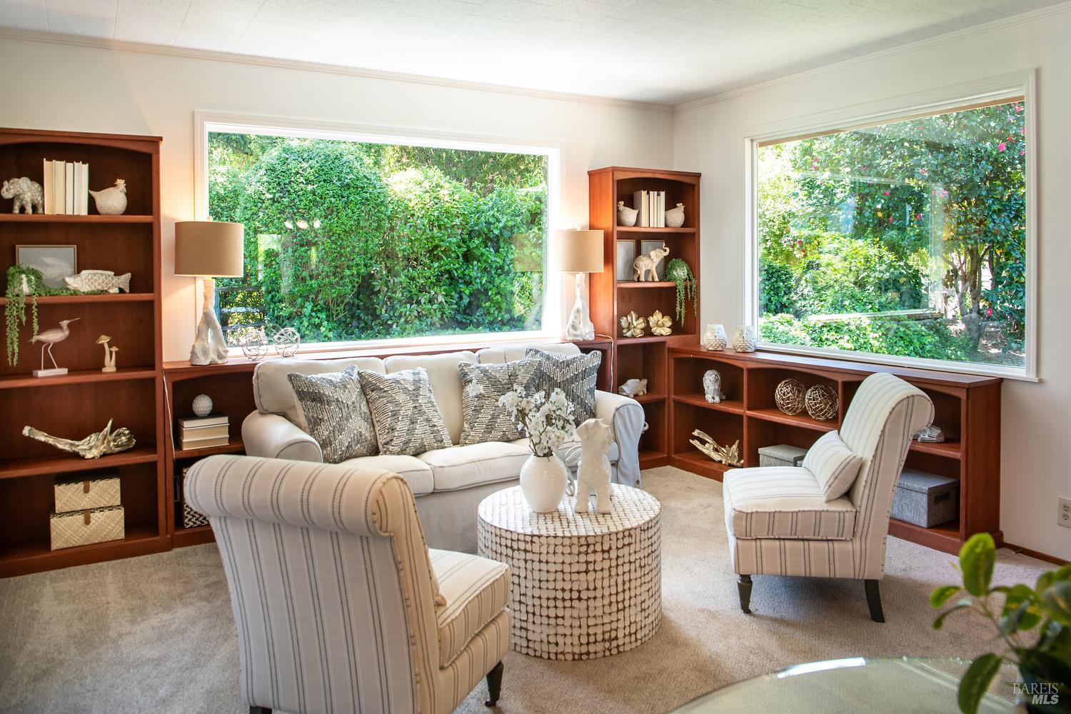 7949 Tocchini Street Sebastopol, CA 95472 - Photo 11 of 34 Family room includes built-in bookshelves and large windows to enjoy the views of the backyard.