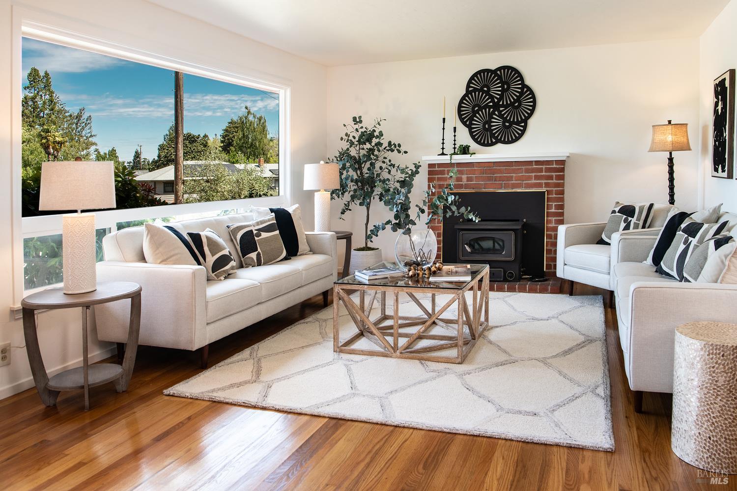 7949 Tocchini Street Sebastopol, CA 95472 - Photo 4 of 34 As you enter the living room, you will love the beautiful picture window and the original wood floors throughout.