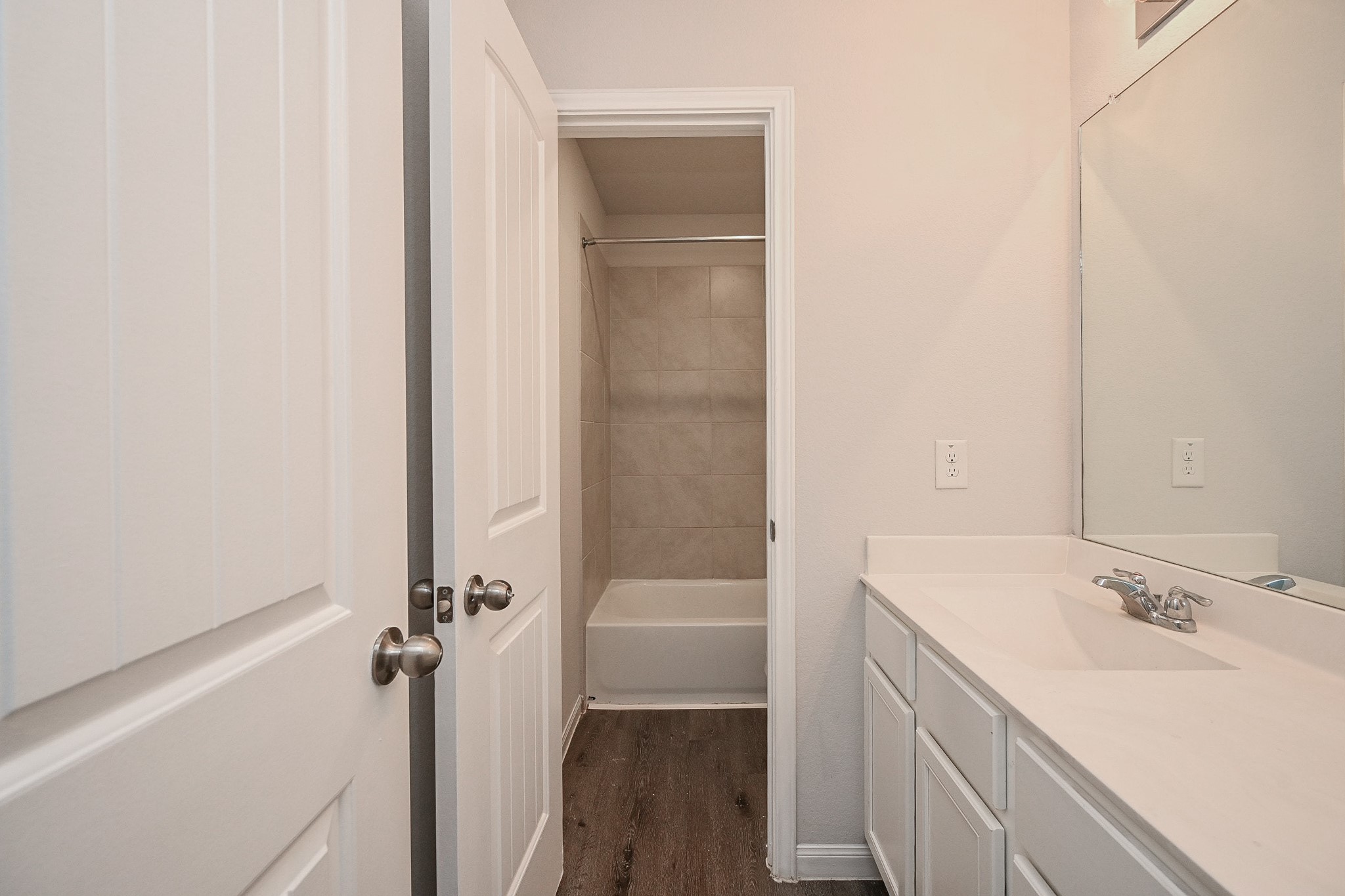22002 Imperious Parkway Houston, TX 77073 - Photo 16 of 20 a bathroom with a sink a tub and a mirror