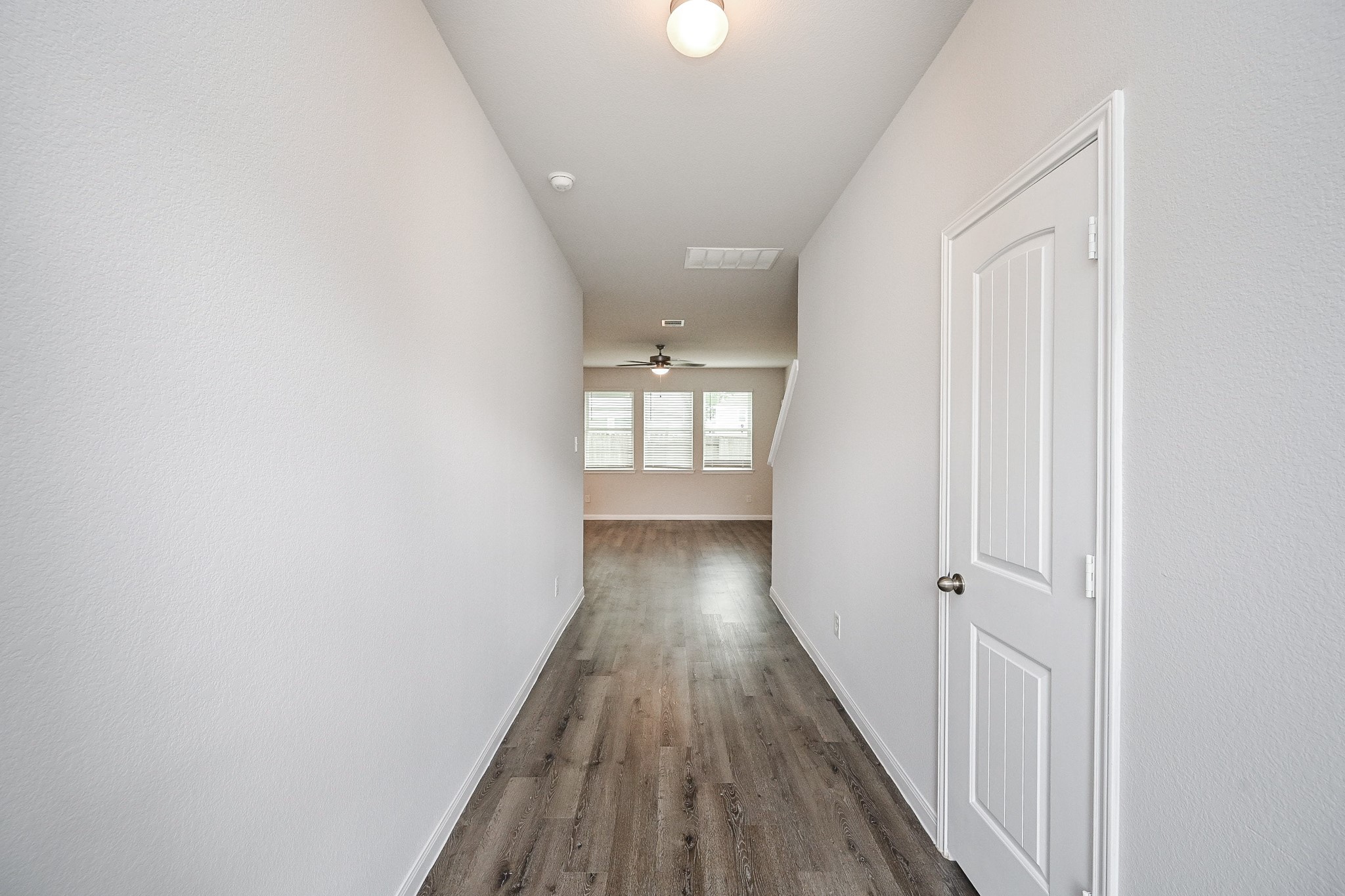 22002 Imperious Parkway Houston, TX 77073 - Photo 4 of 20 a view of a hallway with wooden floor and closet