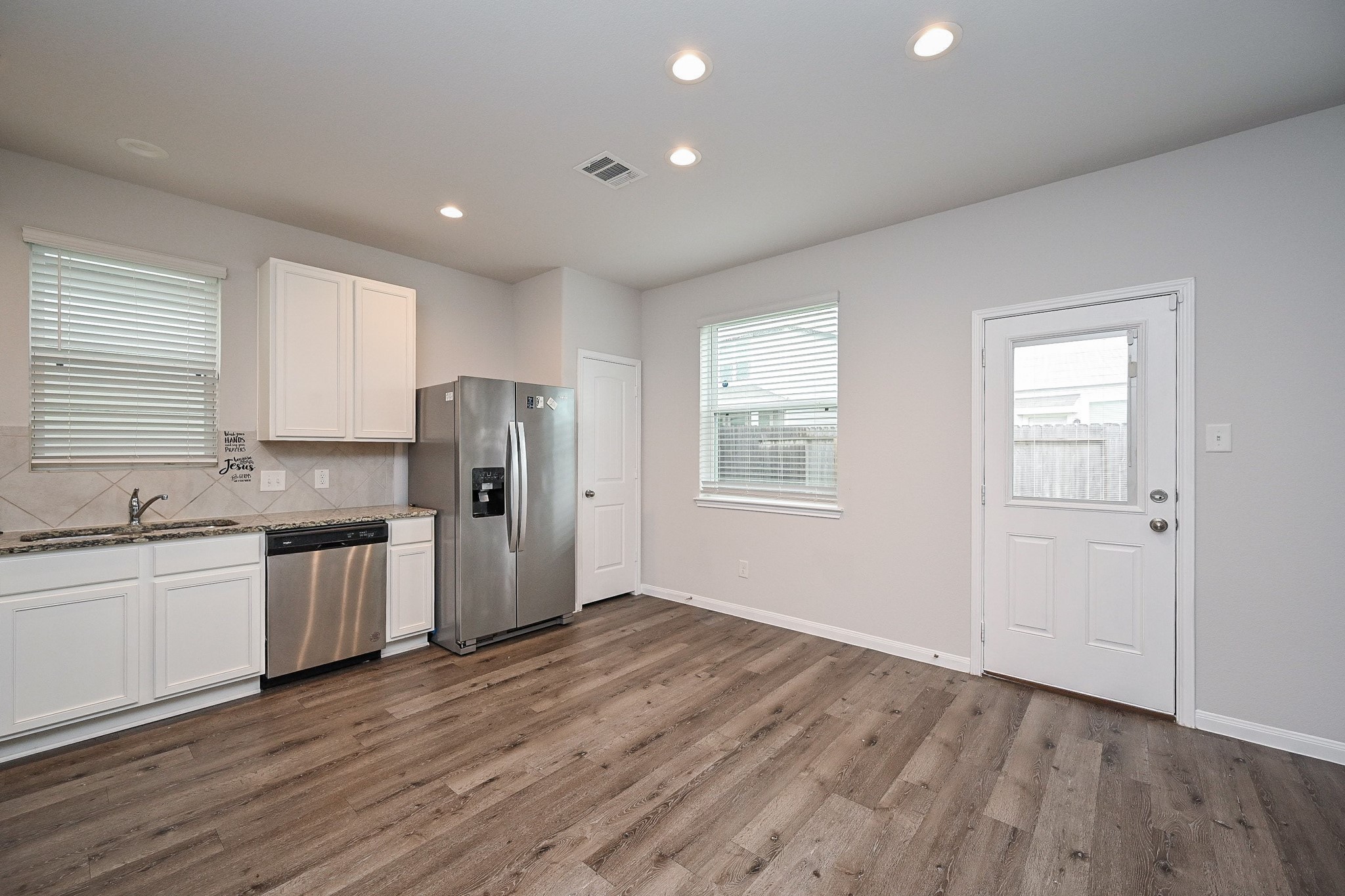 22002 Imperious Parkway Houston, TX 77073 - Photo 7 of 20 a kitchen with a refrigerator and a stove top oven
