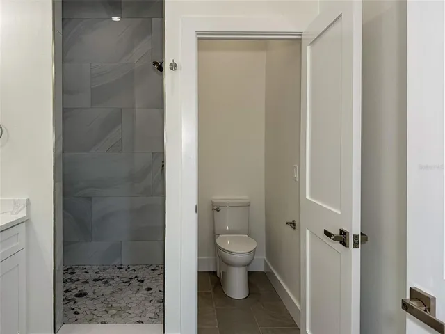 a bathroom with a double vanity sink and mirror