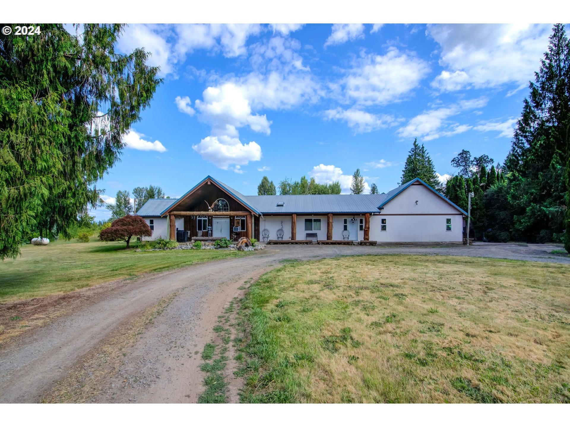 29264 South Barlow Road Canby, OR 97013 - Photo 2 of 46 a view of a house with a yard