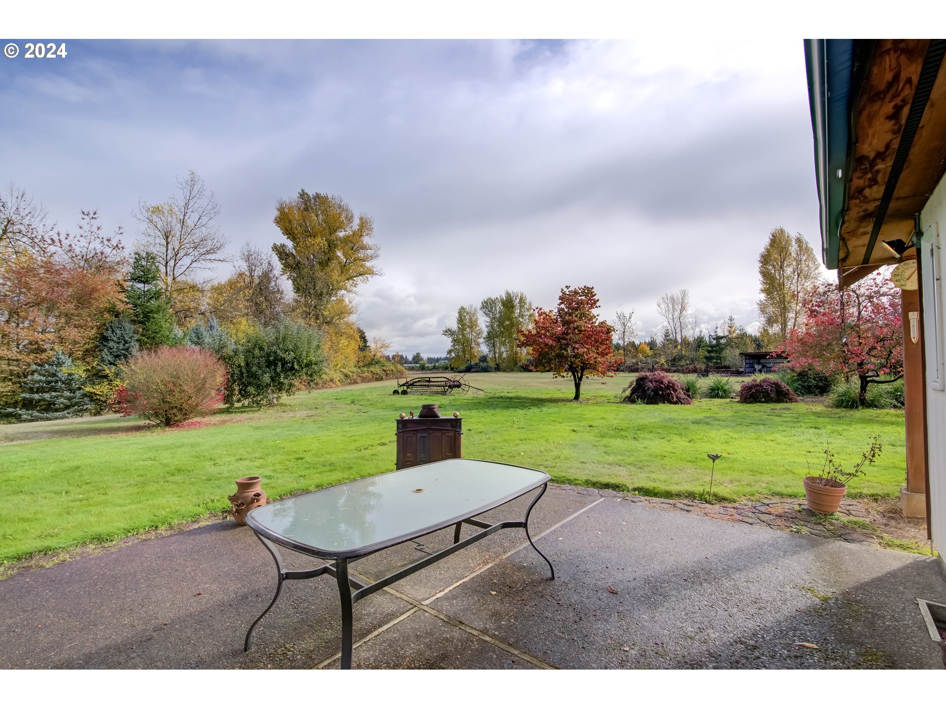 29264 South Barlow Road Canby, OR 97013 - Photo 46 of 46 a backyard of a house with lots of green space and lake view
