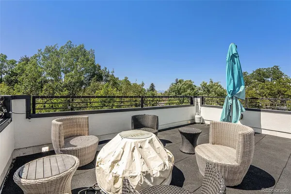 a view of a chairs and table in patio