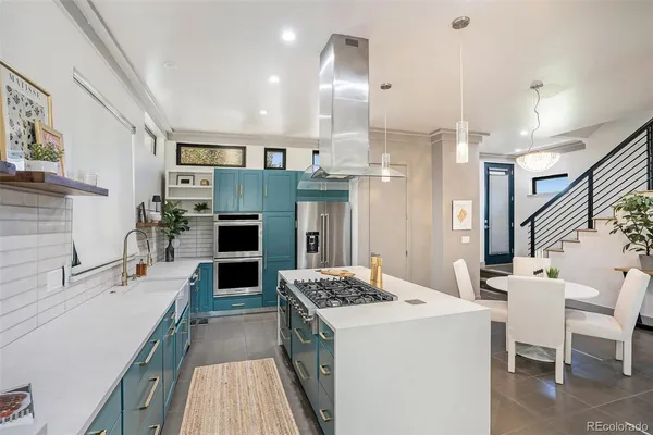 a kitchen with a table and chairs in it