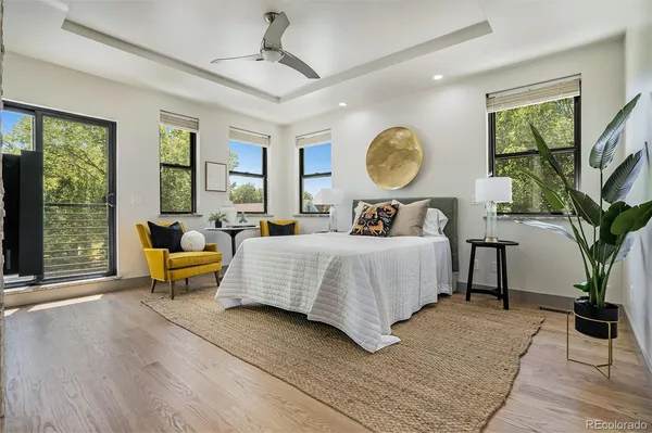 a bed room with a bed and a potted plant