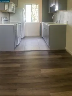 a view of a kitchen with a sink cabinets and a window