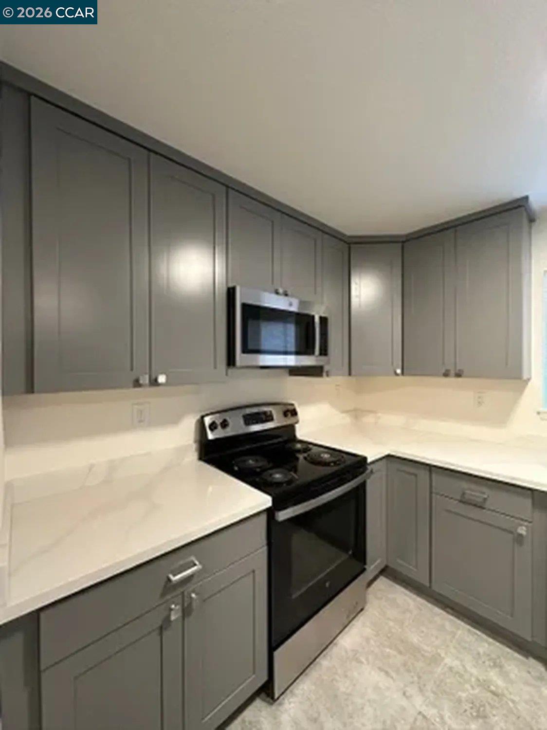 568 Dean Street Hayward, CA 94541 - Photo 17 of 17 a kitchen with stainless steel appliances granite countertop a sink and a stove