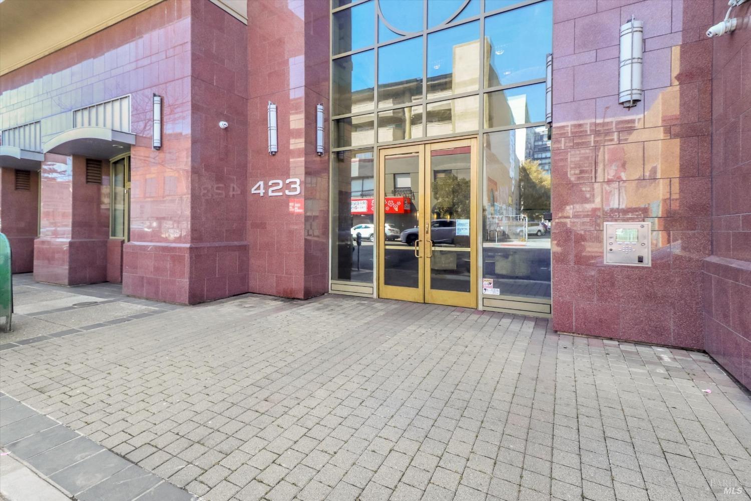 423 7th Street, Unit 105 Oakland, CA 94607 - Photo 1 of 28 an empty room with entrance and door