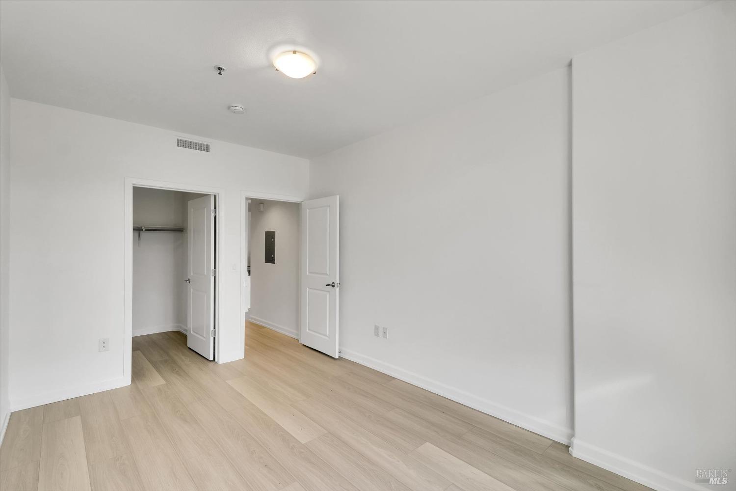 423 7th Street, Unit 105 Oakland, CA 94607 - Photo 20 of 28 a view of hallway with wooden floor